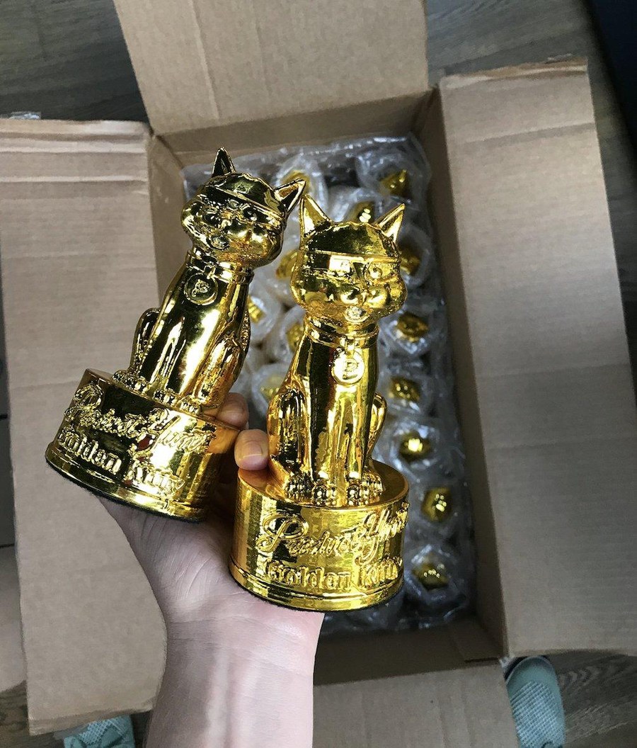 Golden Kitty trophies being unboxed from a shipping box